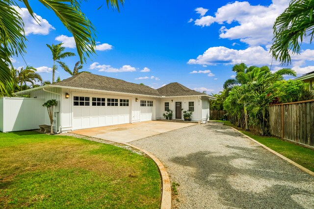 5413 Nakoa St, Koloa, HI 96756 - single story home with gravel driveway, an attached garage, and board and batten siding