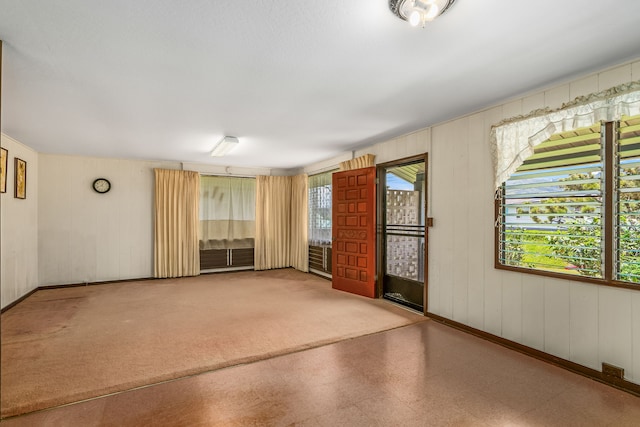 2492 Kino Rd, Kalaheo, HI 96741 - unfurnished room featuring baseboards and wood walls
