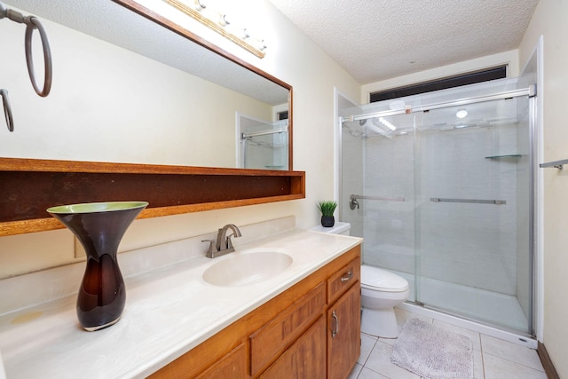 81-6267 Piko Rd, Captain Cook, HI 96704 - bathroom featuring toilet, vanity, a shower stall, tile patterned flooring, and a textured ceiling