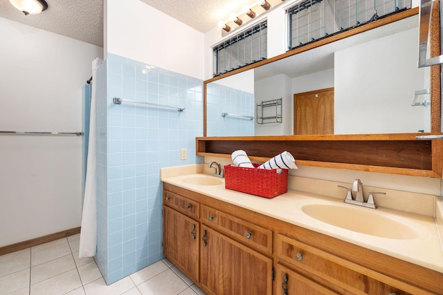 81-6267 Piko Rd, Captain Cook, HI 96704 - full bath with double vanity, a textured ceiling, tile patterned floors, tile walls, and curtained shower