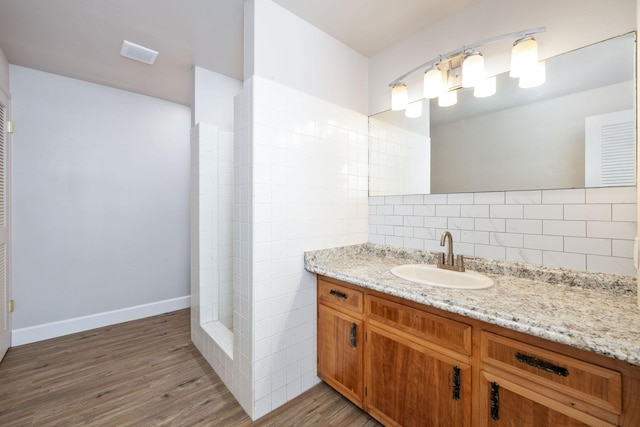 81-6267 Piko Rd, Captain Cook, HI 96704 - bathroom with backsplash, vanity, wood finished floors, and baseboards