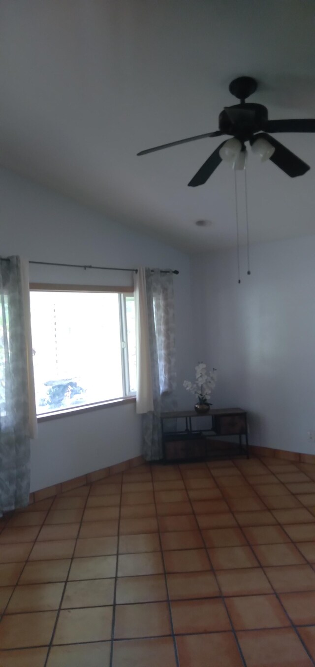 14-3431 Seadrift Rd, Pahoa, HI 96778 - empty room with lofted ceiling, light tile patterned floors, and a ceiling fan