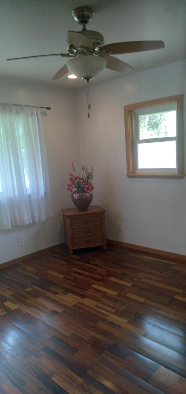 14-3431 Seadrift Rd, Pahoa, HI 96778 - empty room featuring a ceiling fan, wood finished floors, and baseboards