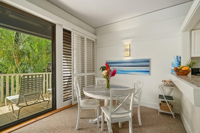 2253 Poipu Rd Unit 440, Koloa, HI 96756 - carpeted dining area with baseboards
