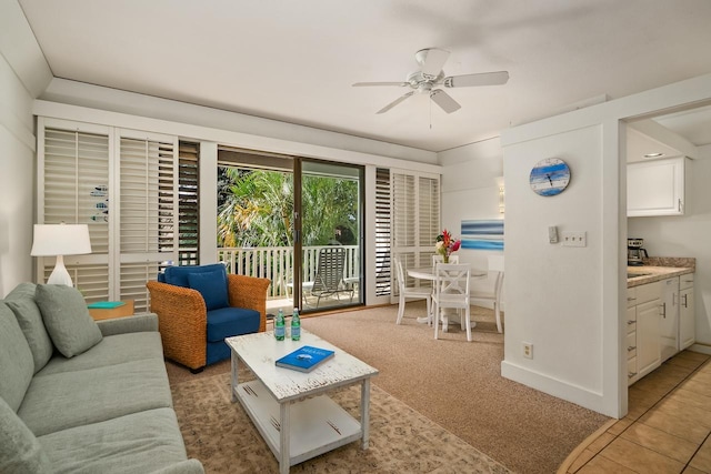 2253 Poipu Rd Unit 440, Koloa, HI 96756 - living room featuring ceiling fan, light carpet, and baseboards