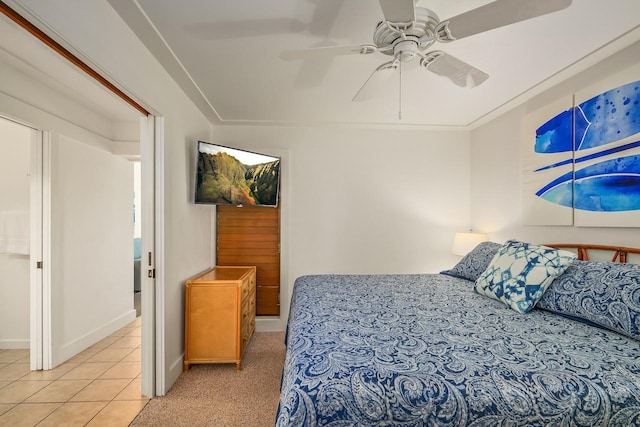 2253 Poipu Rd Unit 440, Koloa, HI 96756 - bedroom with light tile patterned flooring, ceiling fan, baseboards, and light colored carpet