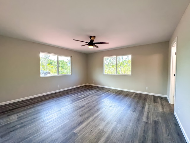 15-1622 3rd Ave, Keaau, HI 96749 - unfurnished room featuring healthy amount of natural light, dark wood-style flooring, ceiling fan, and baseboards