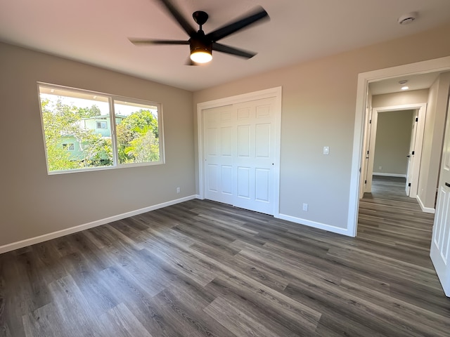15-1622 3rd Ave, Keaau, HI 96749 - unfurnished bedroom with baseboards, dark wood-type flooring, and a closet