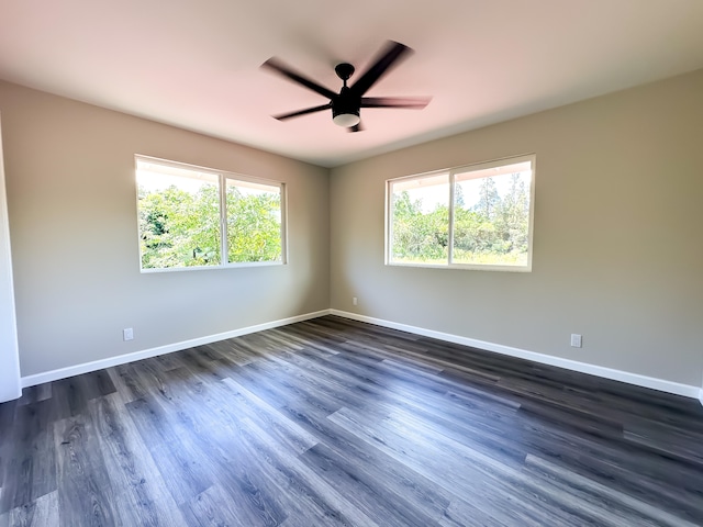 15-1622 3rd Ave, Keaau, HI 96749 - empty room featuring a ceiling fan, dark wood-style flooring, and baseboards