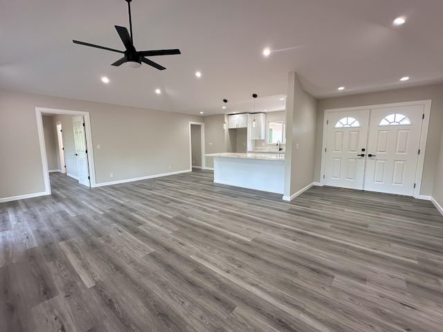 15-1622 3rd Ave, Keaau, HI 96749 - unfurnished living room with dark wood-style floors, recessed lighting, ceiling fan, and baseboards