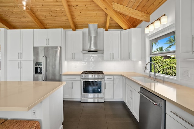 5-7084 Kuhio Hwy, Hanalei, HI 96714 - kitchen featuring appliances with stainless steel finishes, wall chimney range hood, a sink, wooden ceiling, and dark tile patterned floors