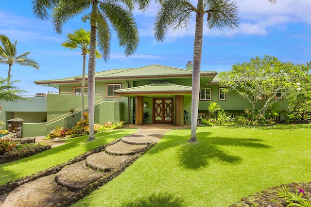 4228-L Waiakalua St Unit B & C, Kilauea, HI 96754 - view of front of house with stucco siding and a front lawn