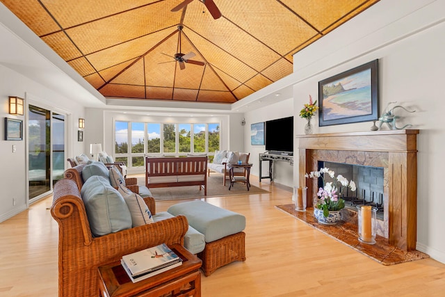 4228-L Waiakalua St Unit B & C, Kilauea, HI 96754 - living room with light wood-style floors, ceiling fan, baseboards, and a high end fireplace