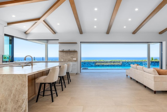 78-7029 Ola Mau St, Kailua-Kona, HI 96740 - living room with beamed ceiling, recessed lighting, and a water view