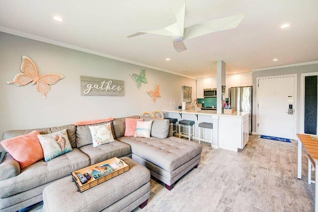 525 Aleka Lp Unit J2, Kapaa, HI 96746 - living area featuring recessed lighting, crown molding, light wood-style floors, and a ceiling fan