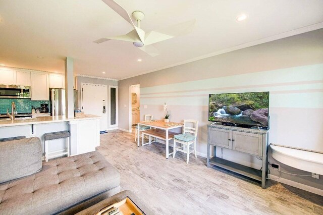 525 Aleka Lp Unit J2, Kapaa, HI 96746 - living area with ornamental molding, light wood-style floors, recessed lighting, ceiling fan, and baseboards