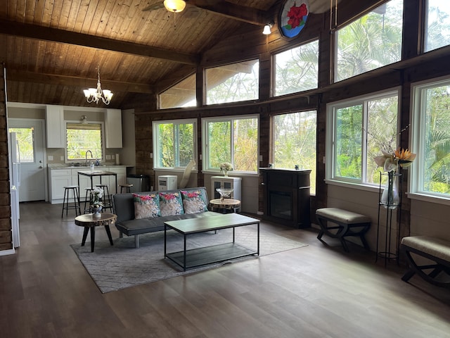 14-3578 Kauai Rd, Pahoa, HI 96778 - living area featuring wood ceiling with exposed beams, high vaulted ceiling, a chandelier, plenty of natural light, and light wood-style floors
