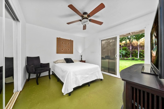 68-1884 Kaupapa Pl, Waikoloa, HI 96738 - bedroom with access to exterior, concrete floors, a ceiling fan, baseboards, and a closet