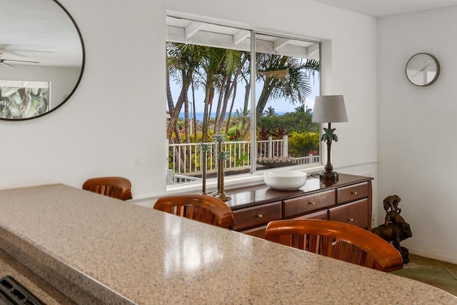 68-1884 Kaupapa Pl, Waikoloa, HI 96738 - dining space featuring ceiling fan, plenty of natural light, and baseboards