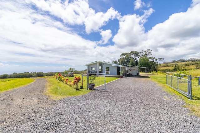 32-491 Piha Kahuku Rd, Ninole, HI 96773 - view of front of home featuring gravel driveway, a gate, and a view of rural / pastoral area