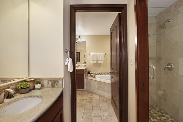 4-820 Kuhio Hwy Unit C106, Kapaa, HI 96746 - bathroom with a stall shower, a bath, two vanities, and stone tile floors
