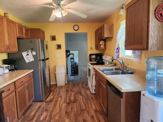 14-3449 Mauna Kea Rd, Pahoa, HI 96778 - kitchen featuring appliances with stainless steel finishes, a sink, dark wood-type flooring, and brown cabinets