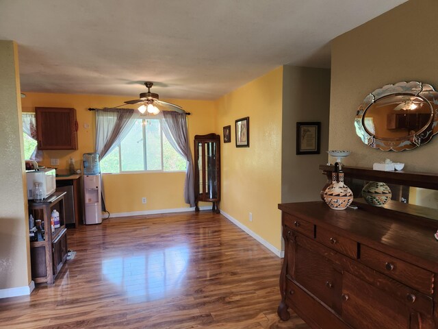 14-3449 Mauna Kea Rd, Pahoa, HI 96778 - living room with dark wood-type flooring, baseboards, and ceiling fan