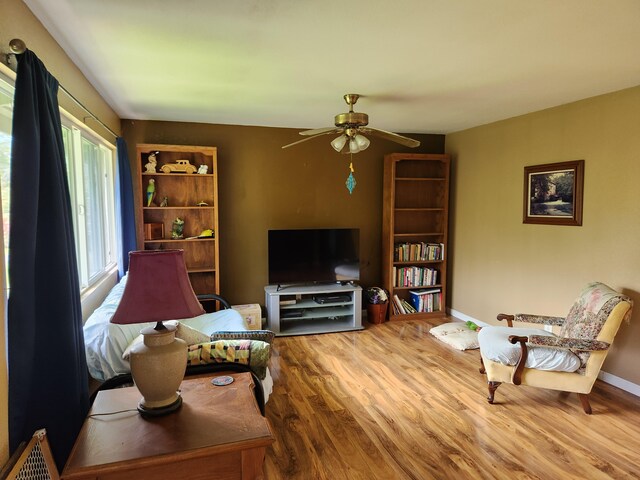 14-3449 Mauna Kea Rd, Pahoa, HI 96778 - living area featuring wood finished floors, ceiling fan, and baseboards