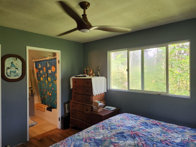14-3449 Mauna Kea Rd, Pahoa, HI 96778 - bedroom with wood finished floors and a ceiling fan