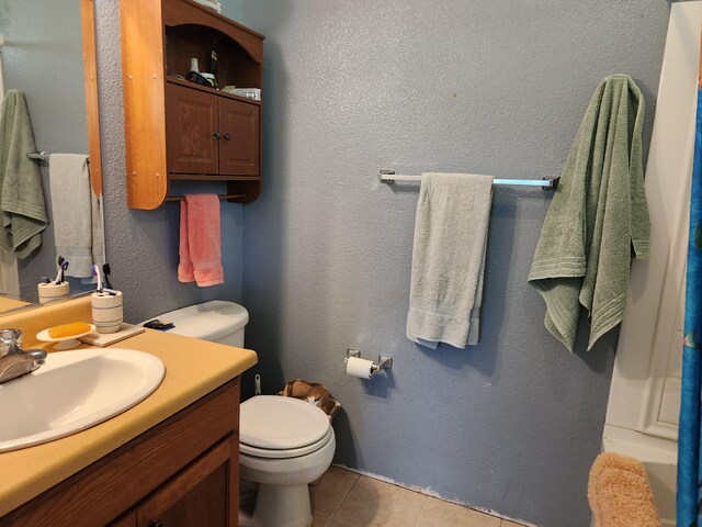 14-3449 Mauna Kea Rd, Pahoa, HI 96778 - bathroom with tile patterned floors, toilet, and vanity