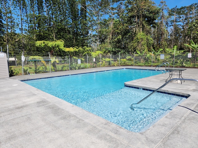 14-3449 Mauna Kea Rd, Pahoa, HI 96778 - community pool with a patio area and view of scattered trees