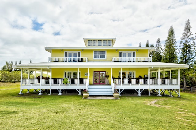 94-2152 S Point Rd, Naalehu, HI 96772 - rear view of property featuring french doors and a lawn