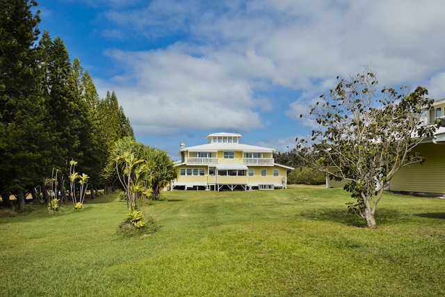 94-2152 S Point Rd, Naalehu, HI 96772 - rear view of property with a lawn