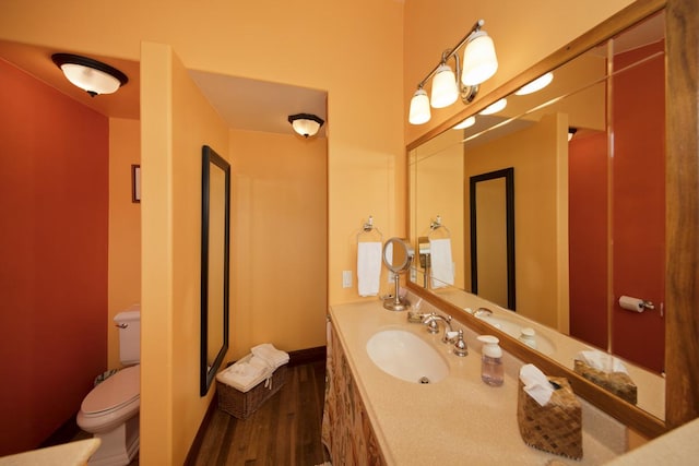 94-2152 S Point Rd, Naalehu, HI 96772 - bathroom with wood finished floors, toilet, vanity, and baseboards