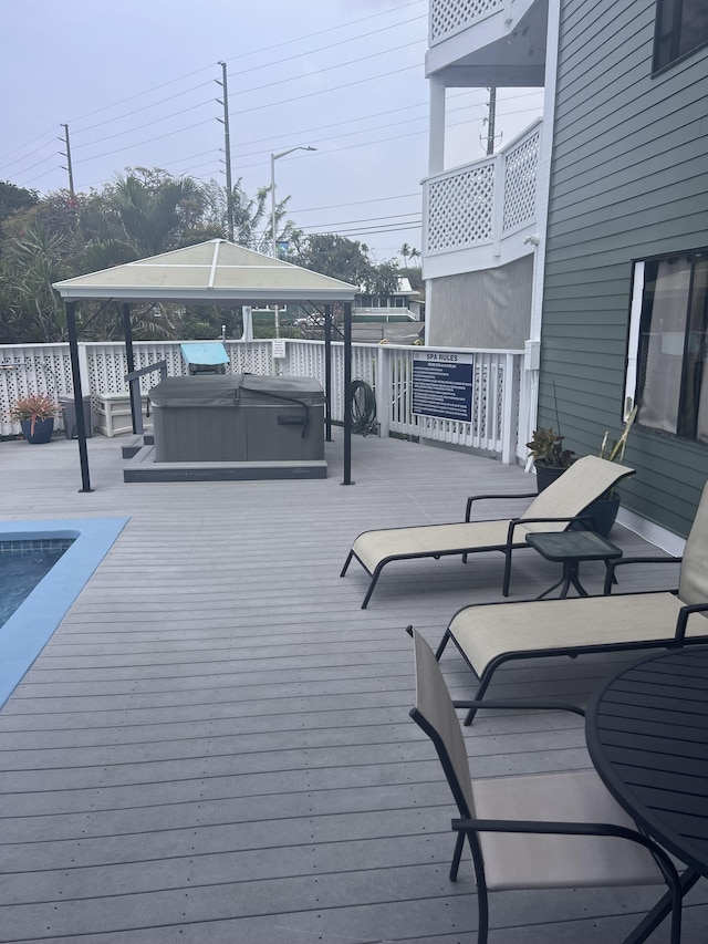 75-5680 Kuakini Hwy Unit 112, Kailua-Kona, HI 96740 - wooden terrace featuring a covered hot tub