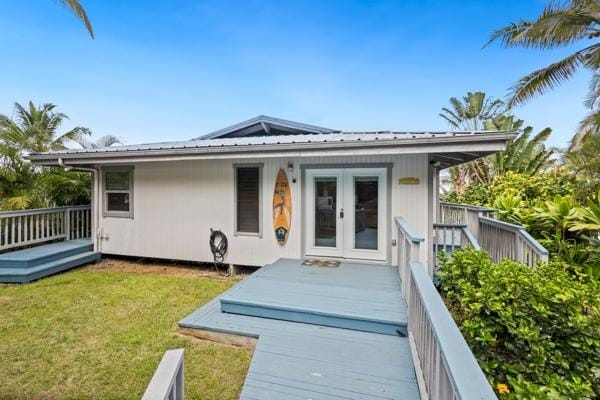 87-3216 Ama Rd, Captain Cook, HI 96704 - back of house featuring french doors, a lawn, a metal roof, and a wooden deck