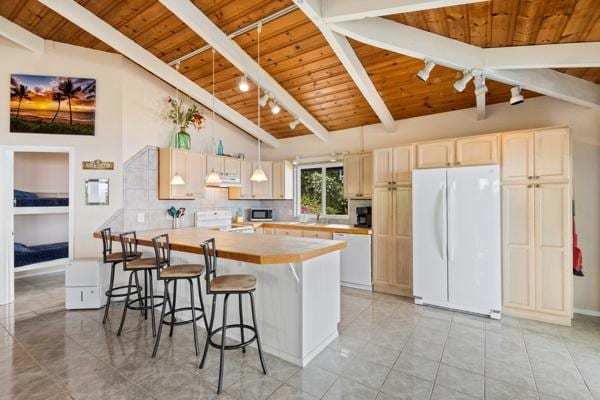 87-3216 Ama Rd, Captain Cook, HI 96704 - kitchen featuring white appliances, a wooden ceiling with exposed beams, light countertops, a breakfast bar area, and tasteful backsplash