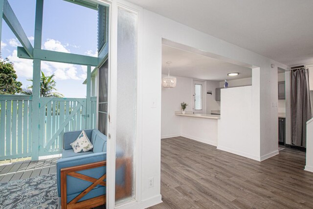 188 Hale St Unit 3C, Hilo, HI 96720 - unfurnished living room featuring wood finished floors and baseboards