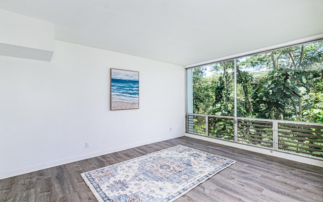 188 Hale St Unit 3C, Hilo, HI 96720 - empty room with wood finished floors and baseboards