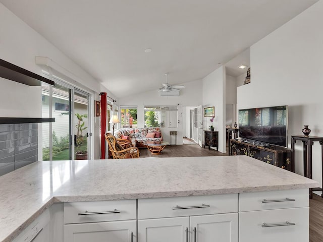 75-252 Nani Kailua Dr Unit 27, Kailua-Kona, HI 96740 - kitchen with open floor plan, ceiling fan, dark wood-style flooring, vaulted ceiling, and white cabinetry