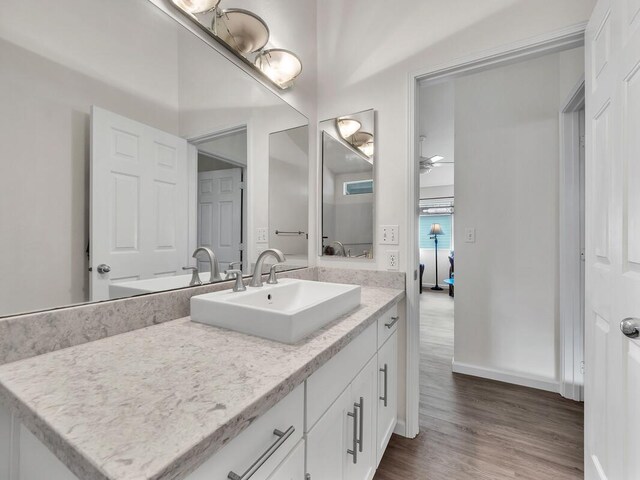 75-252 Nani Kailua Dr Unit 27, Kailua-Kona, HI 96740 - bathroom featuring vanity, wood finished floors, baseboards, and a ceiling fan