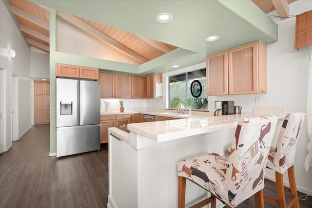 87-3194 Carissa Rd, Captain Cook, HI 96704 - kitchen with appliances with stainless steel finishes, a sink, a peninsula, a kitchen bar, and light brown cabinets