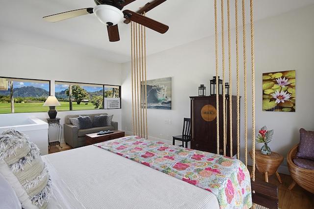 2750 Milo Hae Lp, Koloa, HI 96756 - bedroom featuring a ceiling fan, baseboards, and wood finished floors