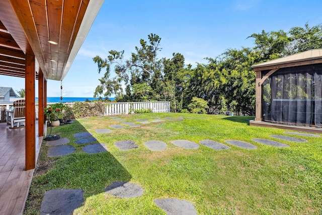 76-206 Kealoha St Unit 2A, Kailua-Kona, HI 96740 - view of yard featuring a water view, a patio area, and a sunroom