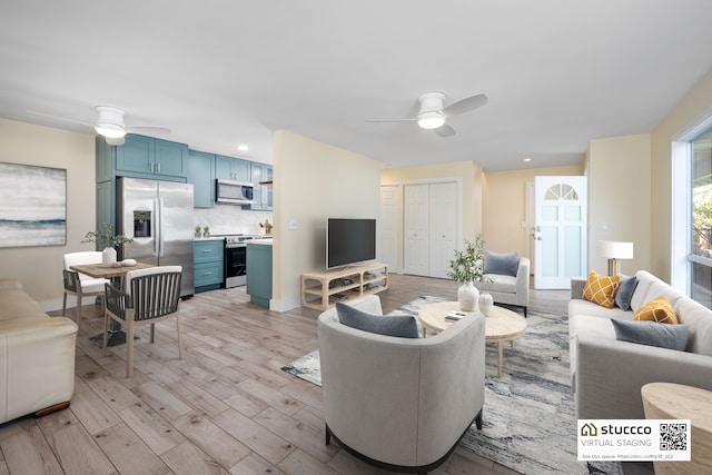 76-206 Kealoha St Unit 2A, Kailua-Kona, HI 96740 - living area with a ceiling fan, light wood-style flooring, recessed lighting, and baseboards