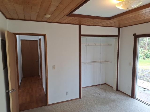 11-3791 4th St, Volcano, HI 96785 - unfurnished bedroom with wooden ceiling, a closet, light carpet, access to exterior, and baseboards