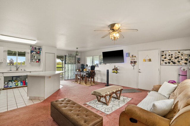 6395 Olohena Rd, Kapaa, HI 96746 - living area featuring light colored carpet, a ceiling fan, plenty of natural light, and light tile patterned flooring