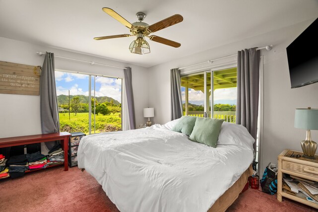 6395 Olohena Rd, Kapaa, HI 96746 - carpeted bedroom featuring multiple windows, access to outside, and ceiling fan