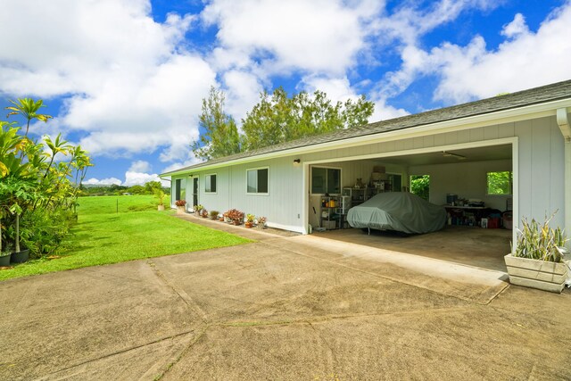 6395 Olohena Rd, Kapaa, HI 96746 - view of side of home featuring a yard, a shingled roof, and a patio