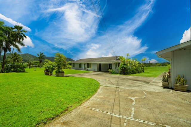6395 Olohena Rd, Kapaa, HI 96746 - view of front of home featuring a front lawn and concrete driveway
